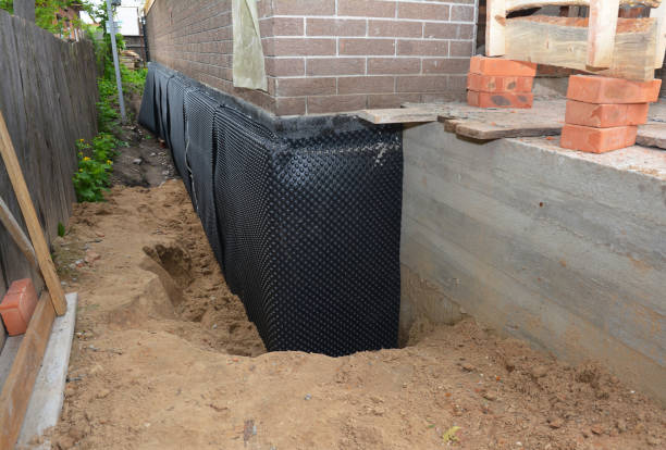 Happy homeowners after waterproofing job in Pioneer